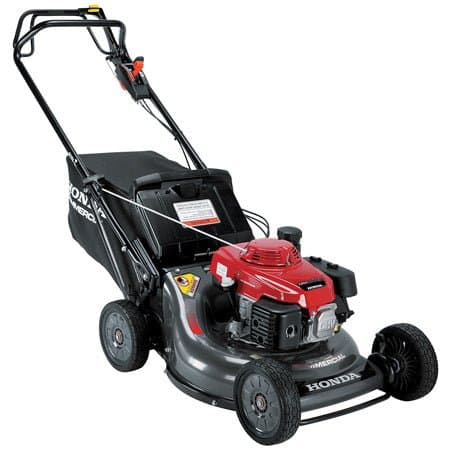 Honda commercial walk-behind lawn mower with a red engine and rear grass collection bag.